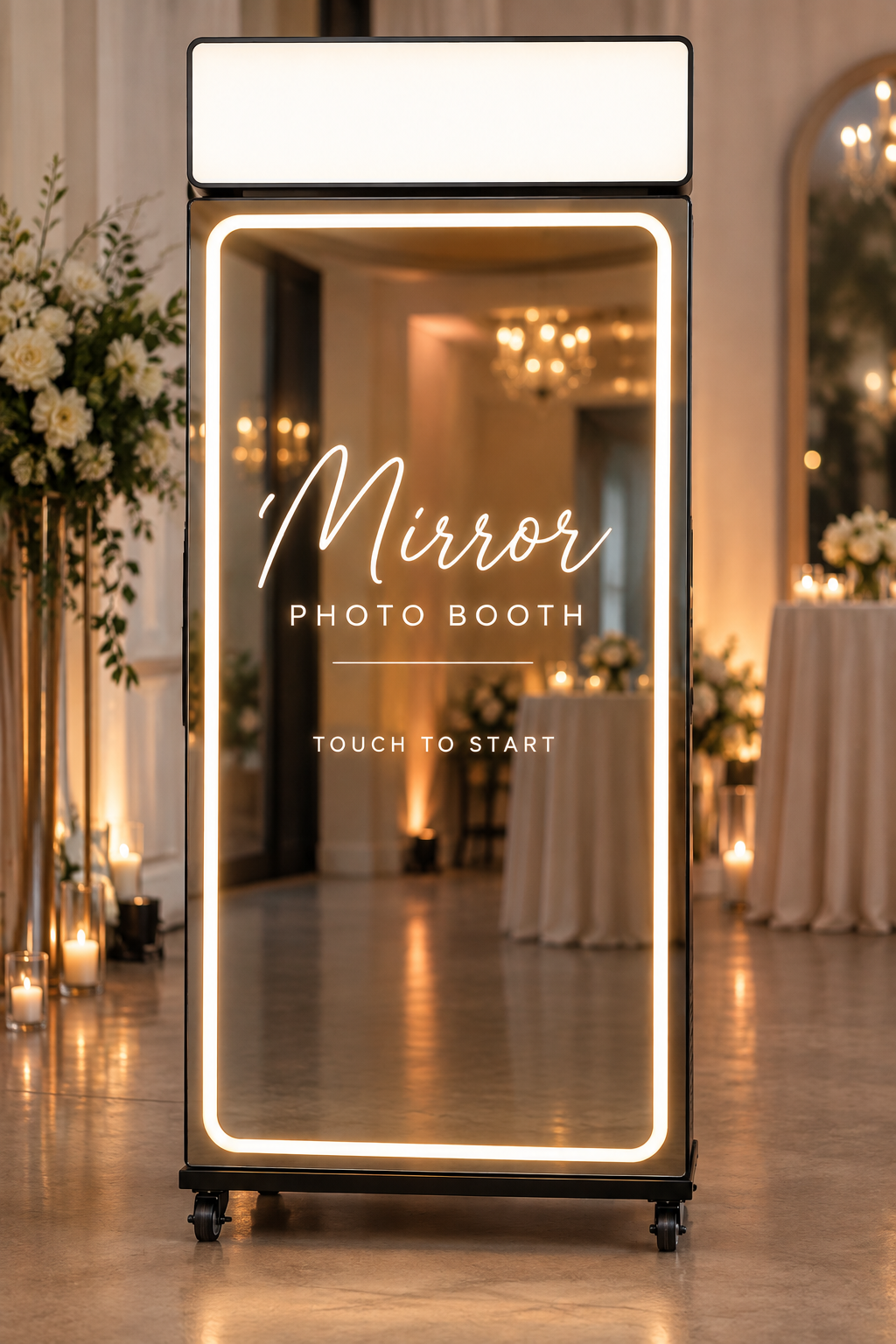 Illuminated mirror photobooth styled with white florals at an event
